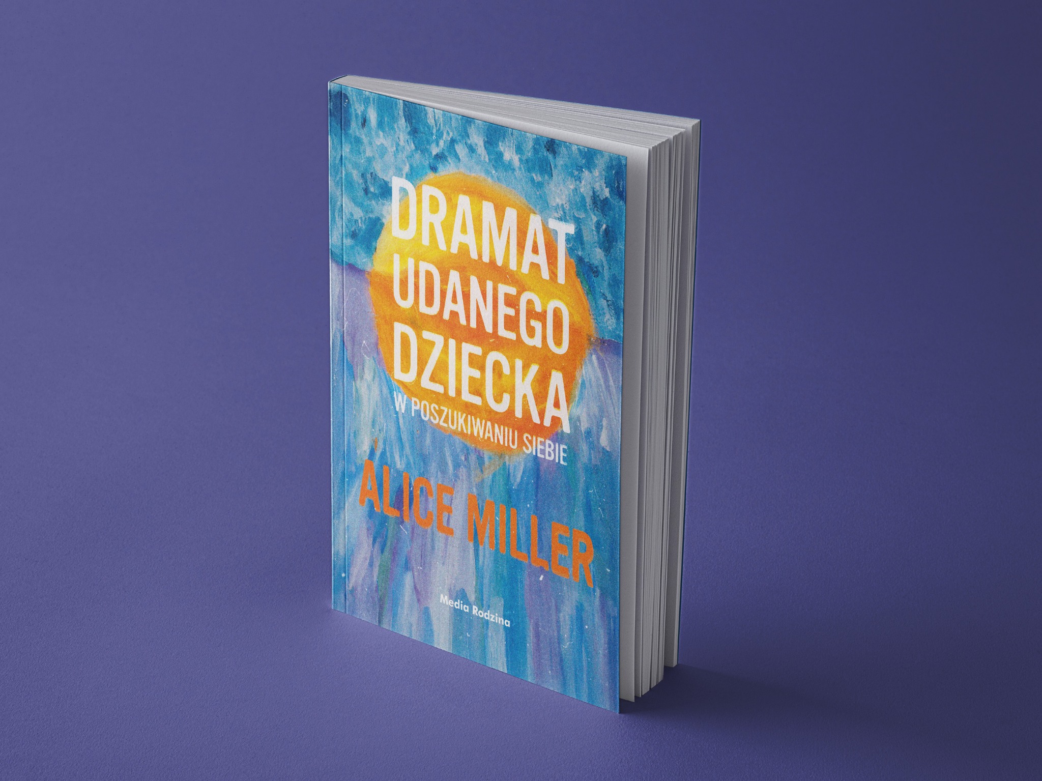 Okładka książki 'Dramat udanego dziecka' Alice Miller, z abstrakcyjnym motywem na niebieskim tle, ustawiona pionowo na fioletowym tle.