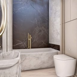 Arteriors - Elegancka łazienka z marmurową wanną, umywalką i złotą armaturą. Ciemne marmurowe ściany kontrastują z jasnymi meblami. Nowoczesny design z dbałością o detale.