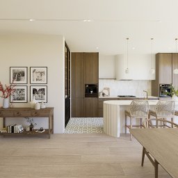 Architektura wnętrz Magdalena Gołdyn Studio Projektowe - Jasne, przestronne wnętrze z drewnianą zabudową kuchenną, wyspą i dekoracyjnymi lampami. Uwagę przykuwają zdjęcia rodzinne i drewniany stolik z dekoracjami.