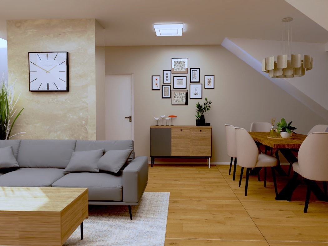 Jasne wnętrze: szara sofa, drewniany stolik kawowy, stół jadalny z krzesłami, komoda z dekoracjami, zegar na ścianie. Całość w ciepłej tonacji, oświetlona naturalnym światłem.