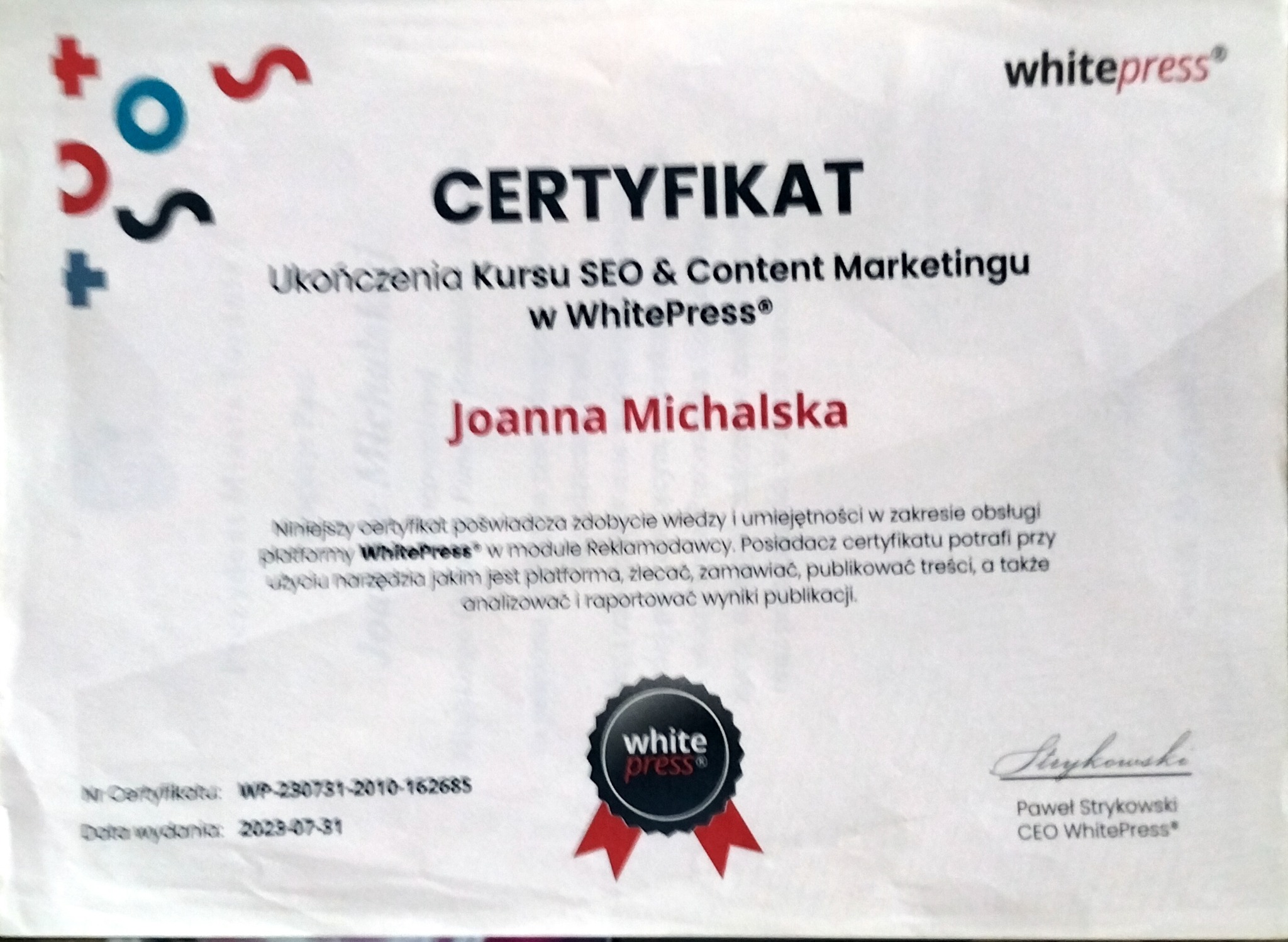 Certyfikat ukończenia kursu SEO & Content Marketingu w WhitePress dla Joanny Michalskiej. Dokument z datą wydania 2023-07-31, podpisany przez CEO WhitePress.