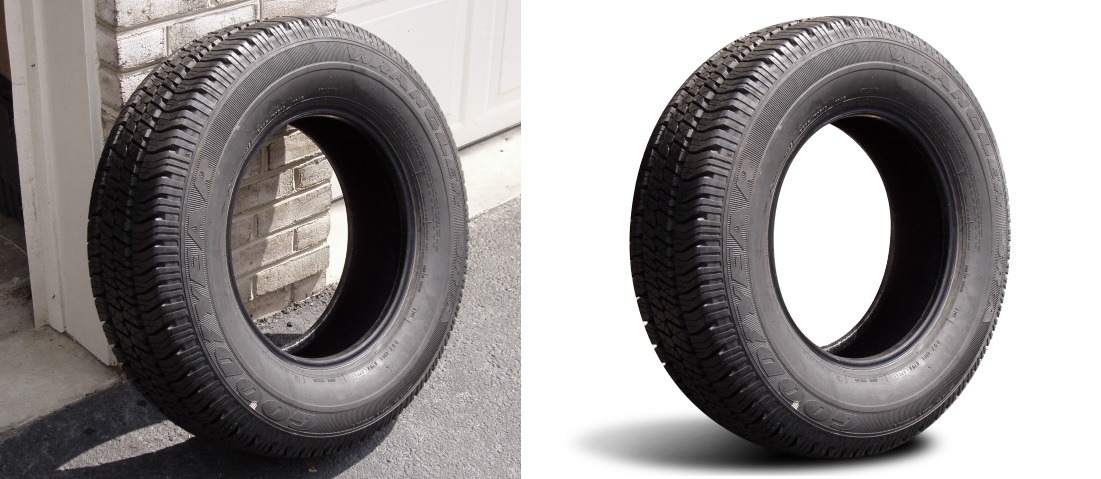 Dwie opony samochodowe Goodyear Wrangler, jedna oparta o ceglany mur, druga na białym tle z cieniem, ukazujące szczegóły bieżnika i boczne napisy.