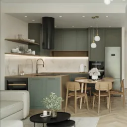 Nowoczesna kuchnia w odcieniach zieleni z drewnianymi krzesłami i okrągłym stołem. Nad stołem wiszą dwie lampy. Na blacie kwiaty w wazonie.