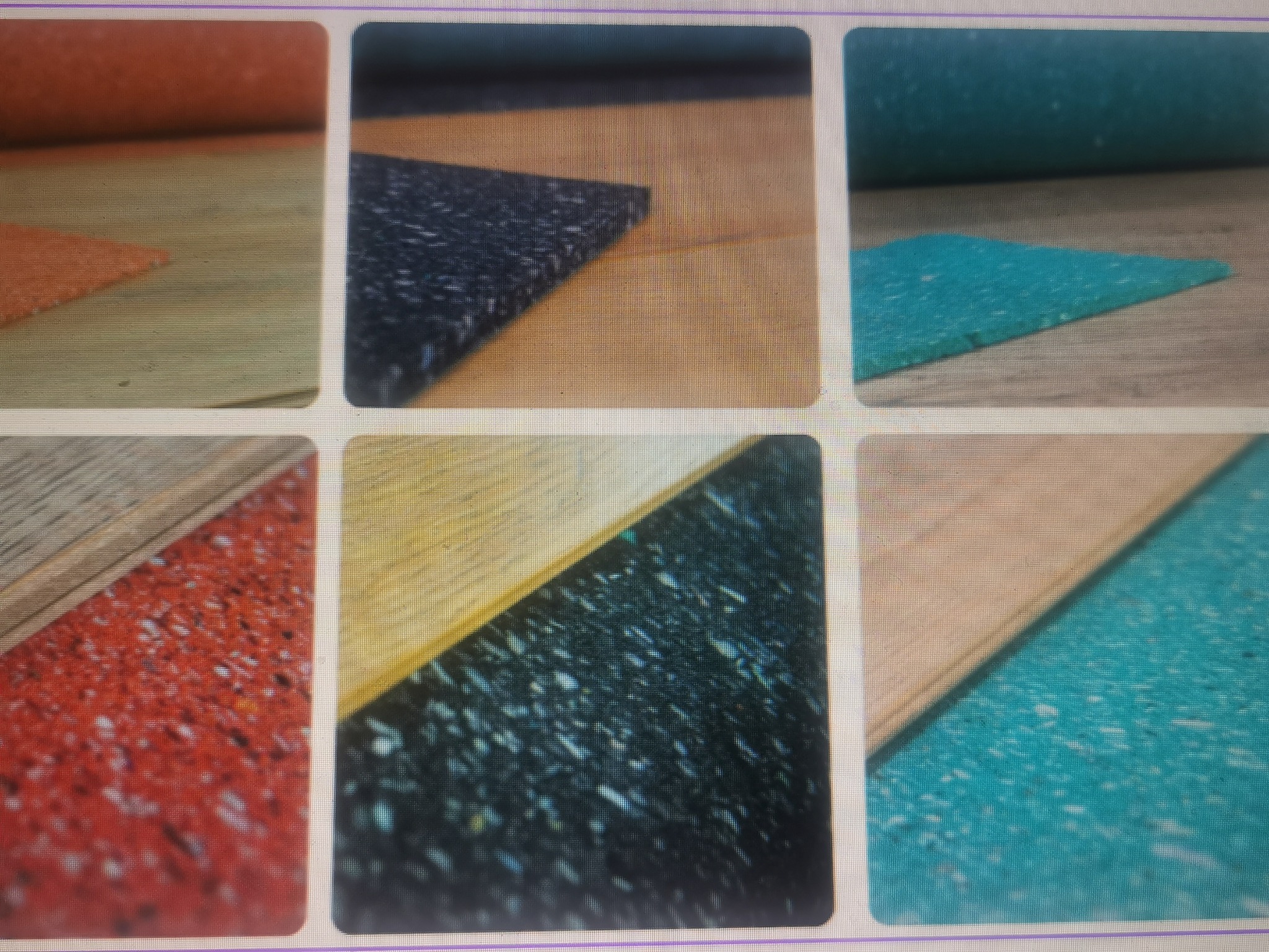 Zbliżenie na próbki różnokolorowych podkładów podłogowych o różnej strukturze, ułożonych na drewnianej powierzchni. Widoczne detale faktury i warstw materiału.