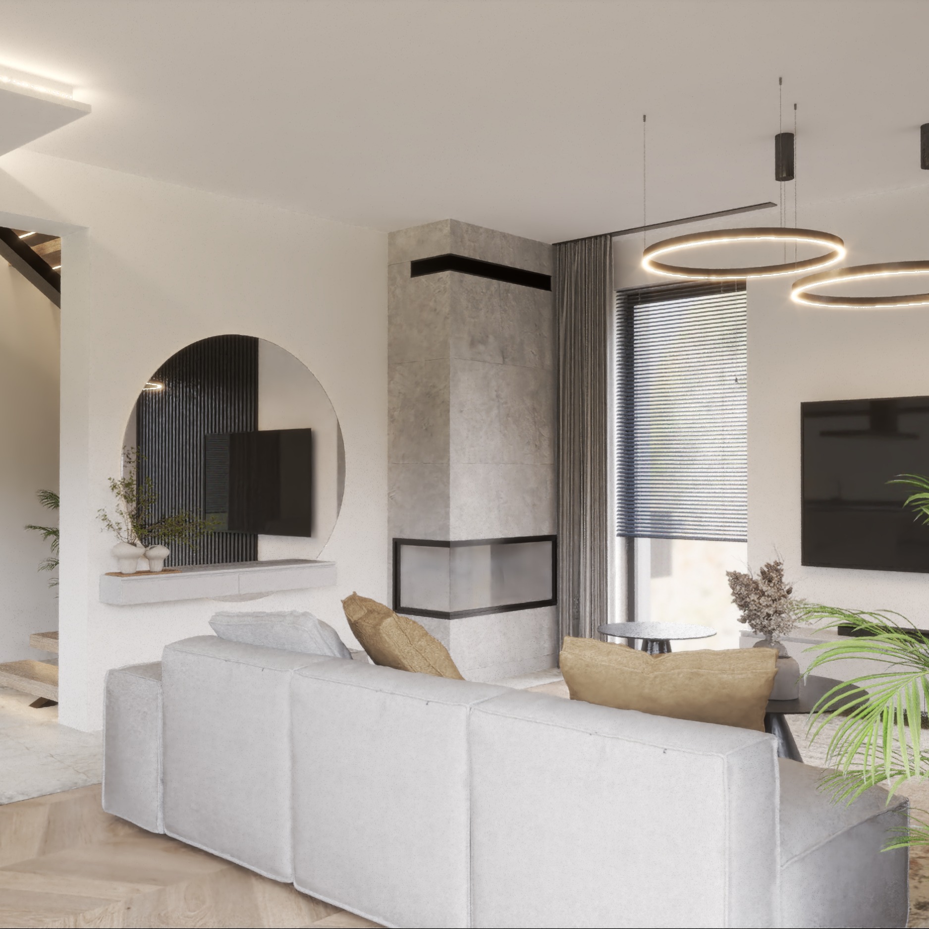 Elegancki salon z szarą sofą modułową, kominkiem obudowanym kamieniem i okrągłym lustrem z czarnymi lamelami. Minimalistyczne oświetlenie i rośliny dodają wnętrzu charakteru.