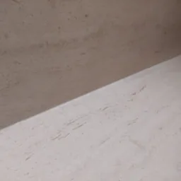 Beżowy blat kuchenny z subtelnym użyleniem, wykonany ze spieku kwarcowego Dekton Marmorio Pietra, z fragmentem płyty grzewczej w prawym górnym rogu.