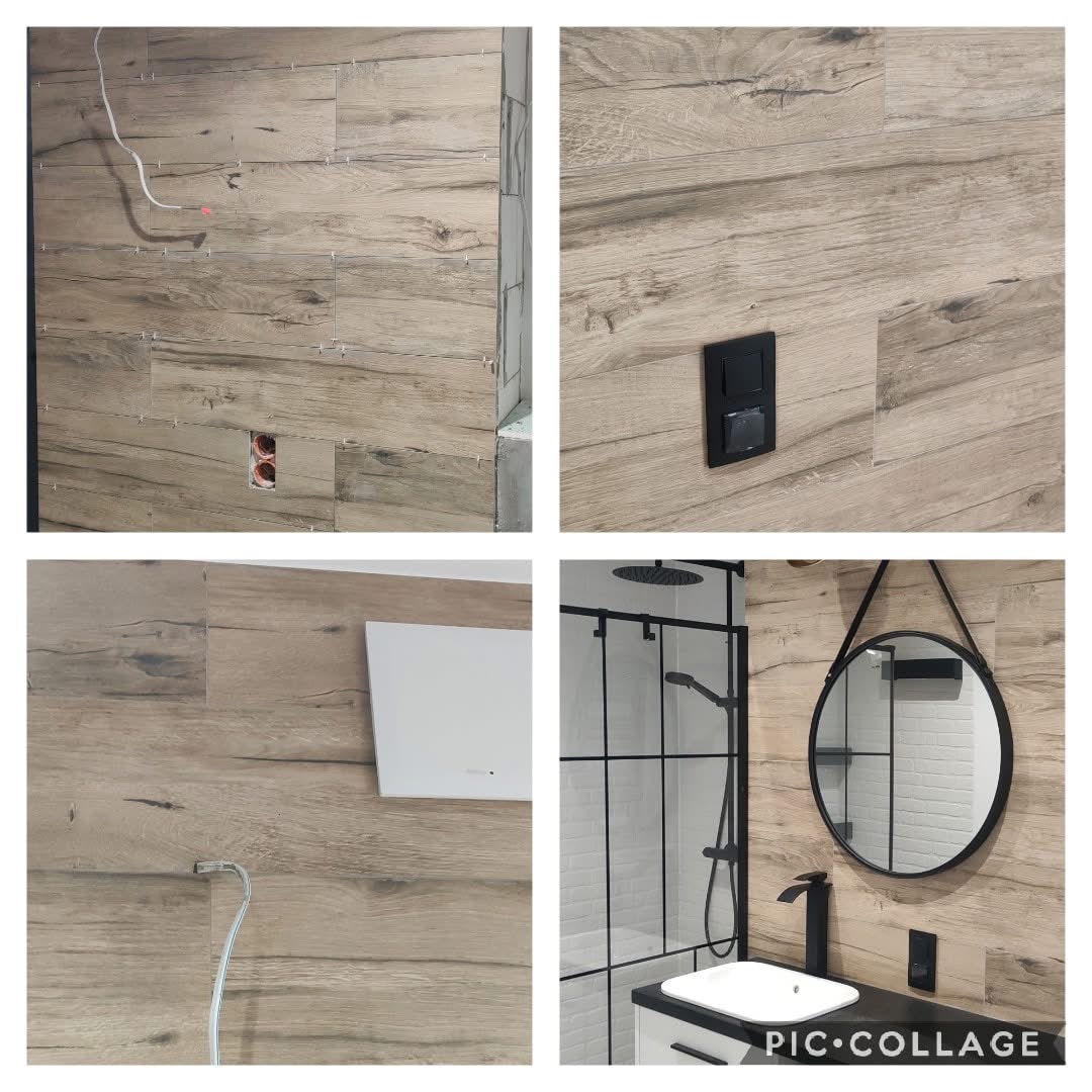 Kafelkowanie ściany w łazience imitujące drewno, z widoczną instalacją elektryczną i fragmentem prysznica z czarną armaturą oraz okrągłym lustrem.