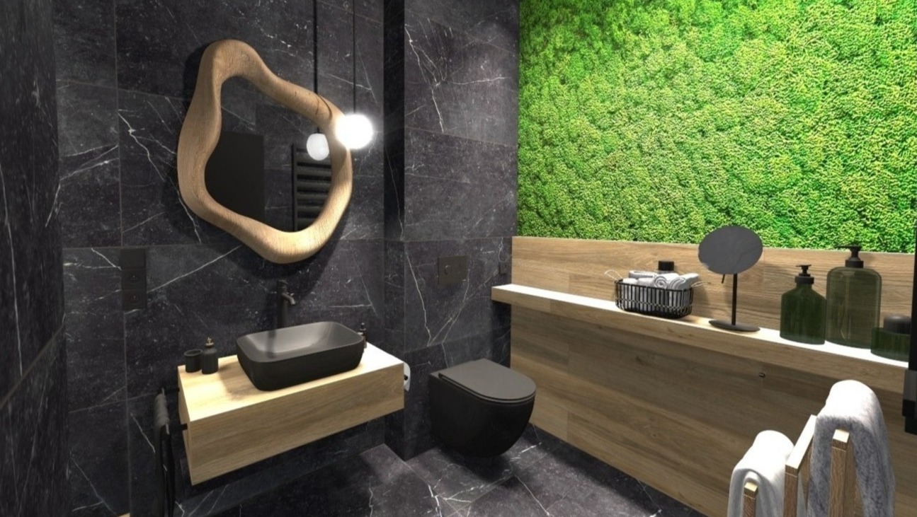 Nowoczesna łazienka z czarnymi marmurowymi płytkami, umywalką na drewnianym blacie, toaletą w kolorze antracytu i ścianą pokrytą mchem.