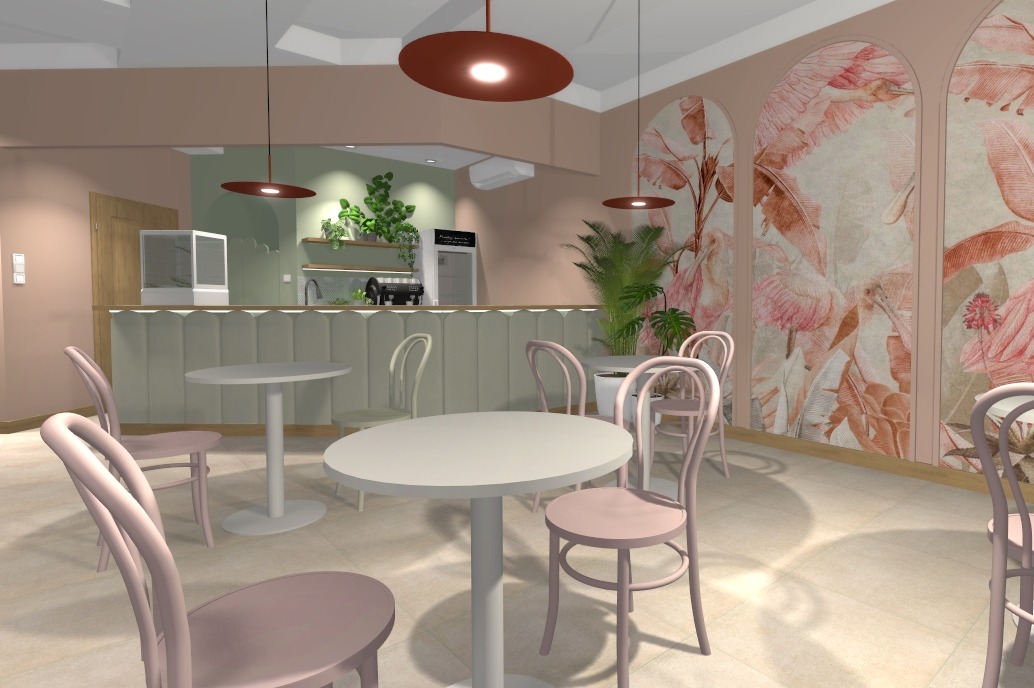 Wnętrze kawiarni z pastelowymi krzesłami i stołami. Na ścianie dekoracyjny motyw roślinny. Oświetlenie punktowe podkreśla przytulny klimat lokalu.