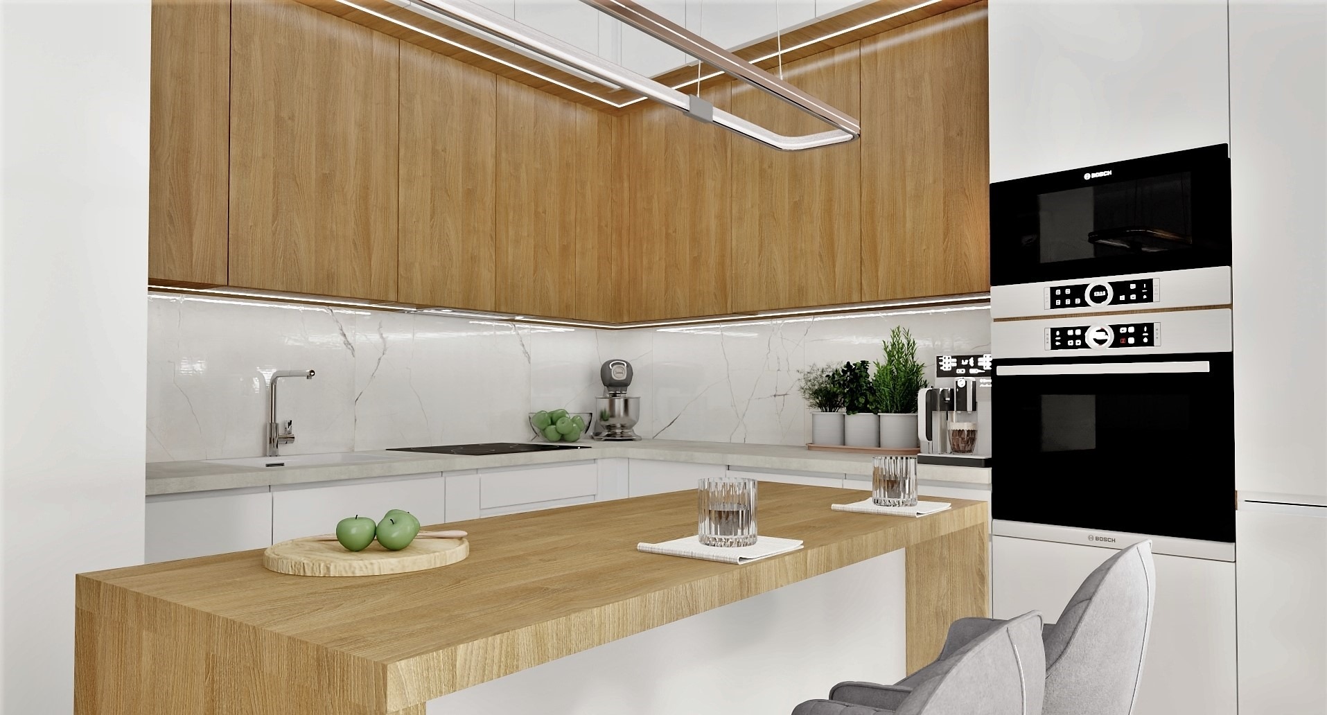 Nowoczesna kuchnia z drewnianymi szafkami, białymi frontami i marmurowym blatem. Na wyspie kuchennej jabłka i szklanki, oświetlenie LED.