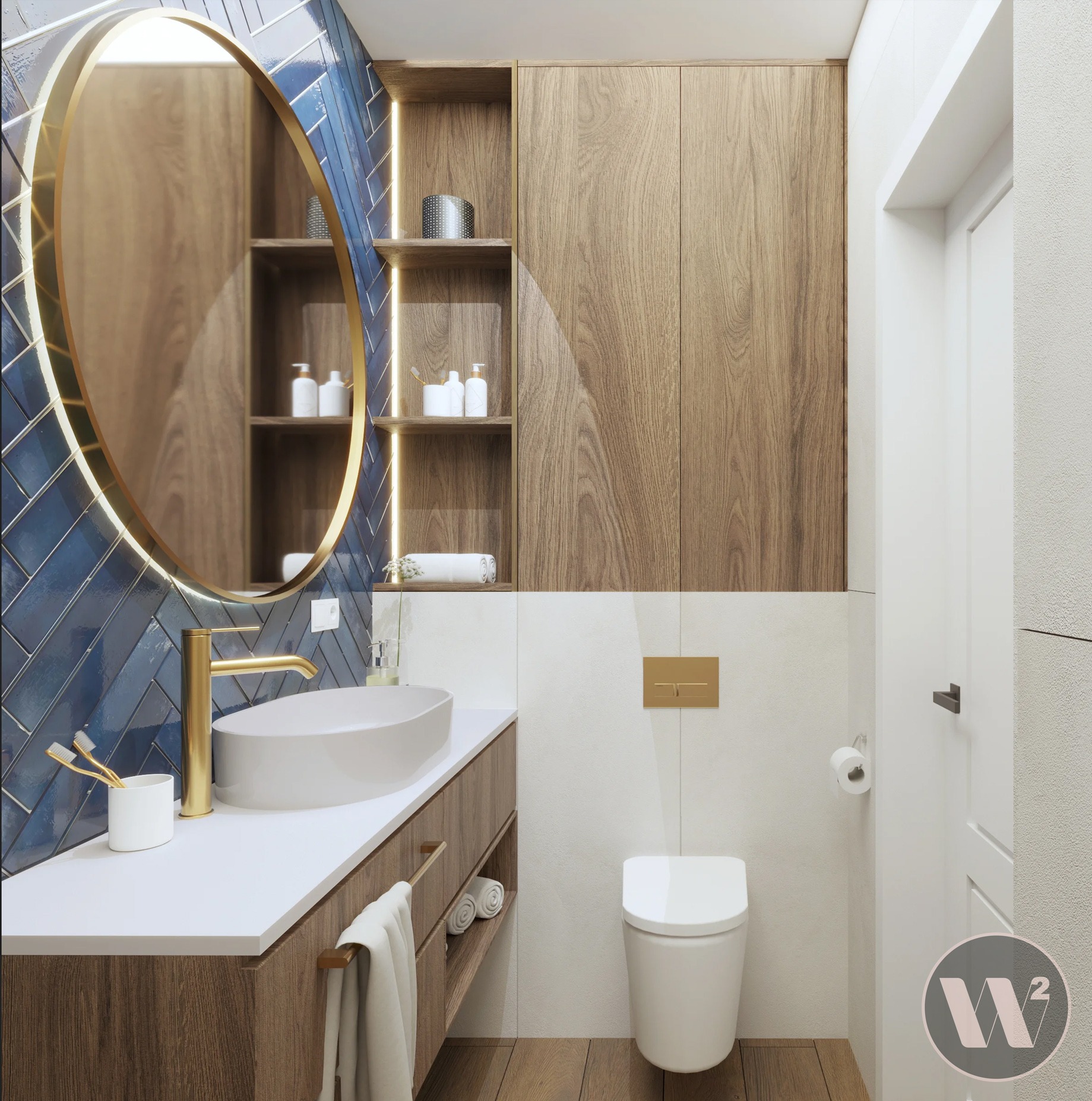 Nowoczesna łazienka z owalnym lustrem podświetlanym złotem, niebieskimi płytkami w jodełkę i drewnianymi szafkami. Minimalistyczna armatura i biała ceramika.