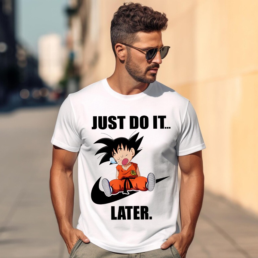 Mężczyzna w okularach, na białej koszulce nadruk: 'JUST DO IT... LATER', postać z anime siedząca na logo Nike. Tło: miejska sceneria, budynki.