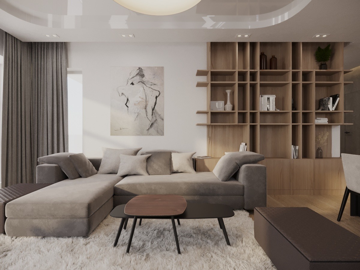 Neutralna tonacja salonu z narożnikiem, stolikiem kawowym i drewnianą biblioteczką. Obraz na ścianie dodaje artystycznego akcentu. Dywan z długim włosiem.