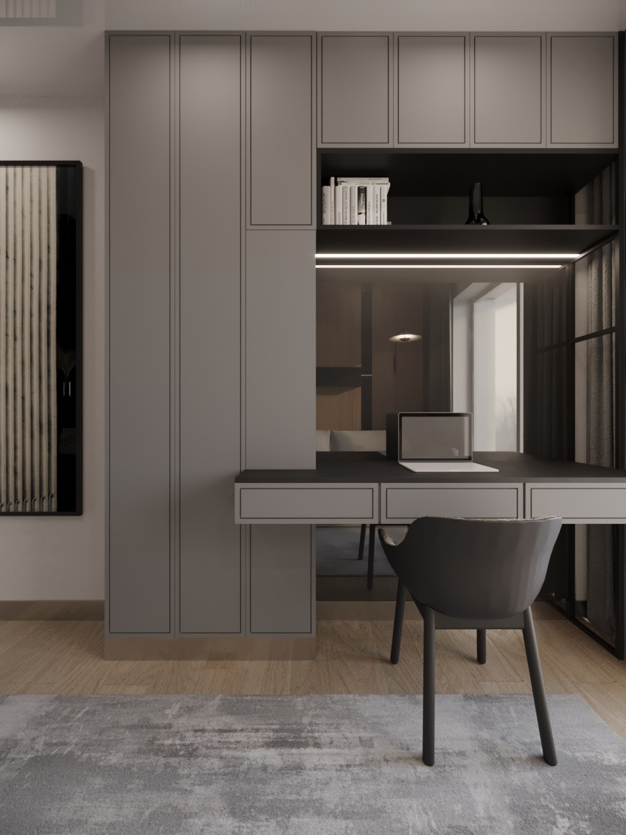 Nowoczesny pokój z szarą zabudową meblową, biurkiem i krzesłem. Na biurku laptop. Minimalistyczny design z oświetleniem LED. W tle widoczny obraz w czarnej ramie.