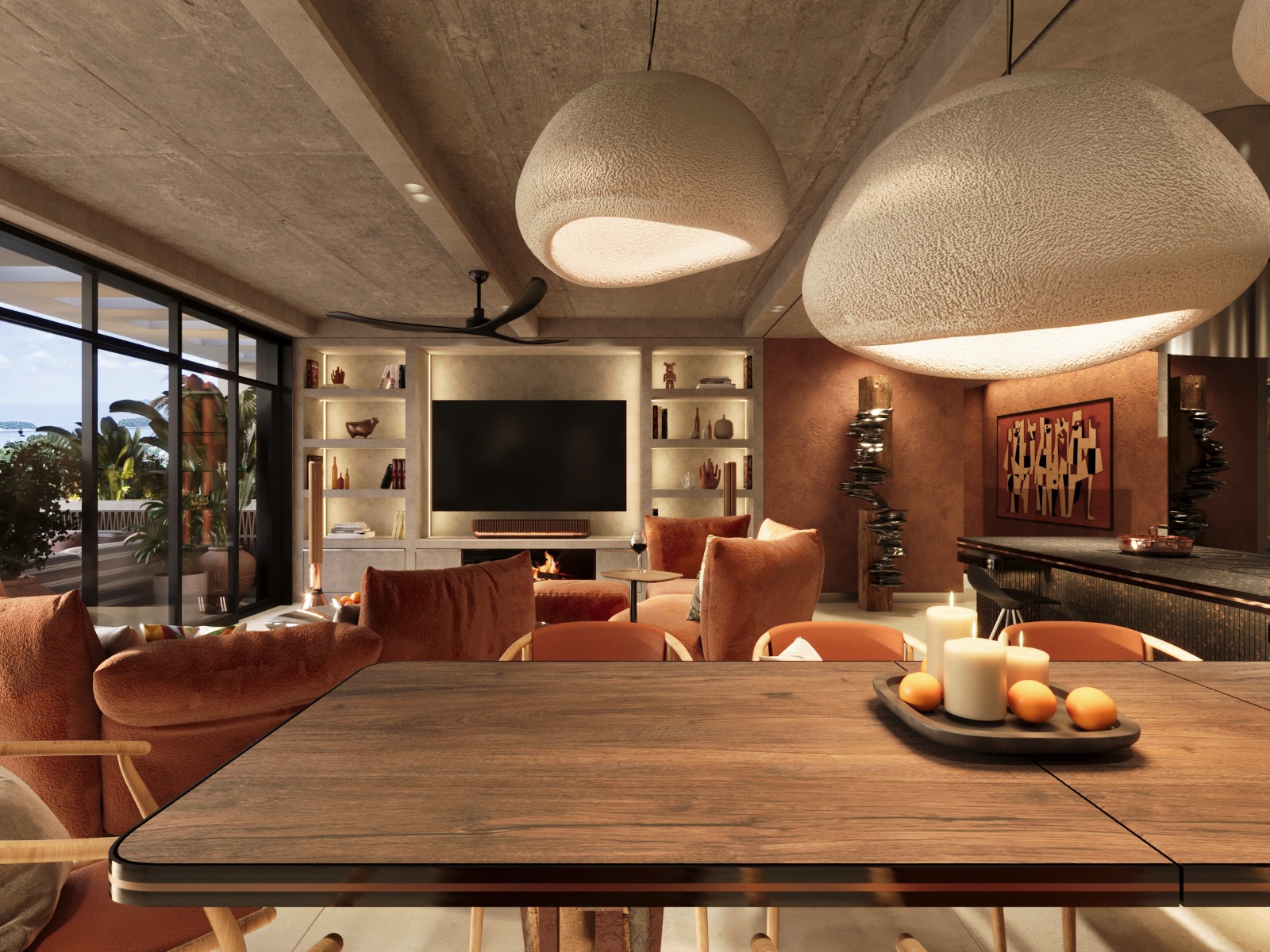 Stylowy salon z widokiem na morze: drewniany stół z owocami i świecami na pierwszym planie, w tle kominek i regały. Całość oświetlona przez designerskie lampy.