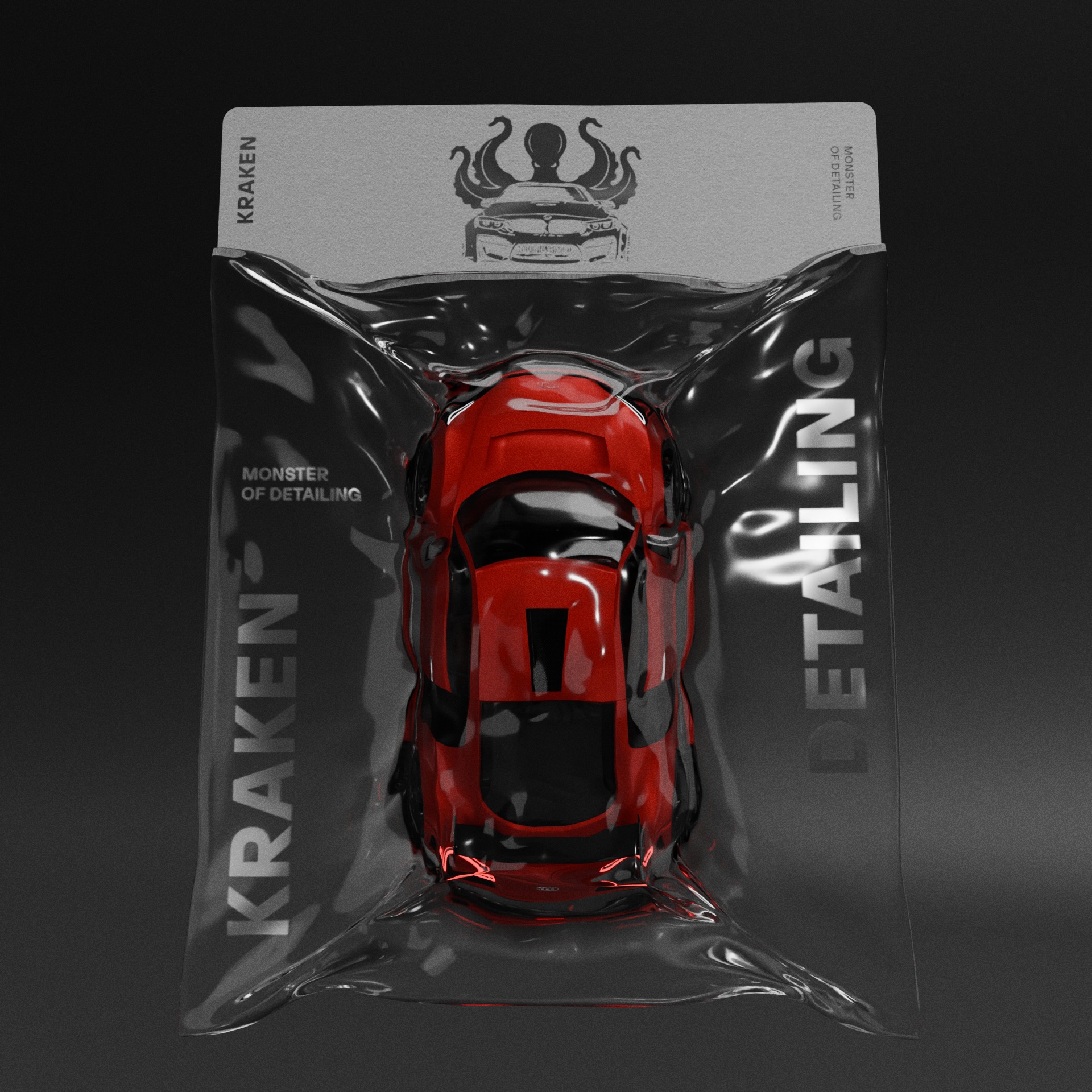 Czerwony model auta w przezroczystym opakowaniu z logo 'Kraken Monster of Detailing' na szarym tle. Specyficzne oświetlenie podkreśla detale opakowania.