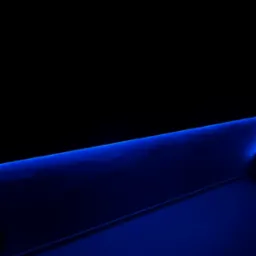 Nowoczesne oświetlenie LED w kolorze niebieskim, podkreślające architektoniczne detale wnętrza. Minimalistyczny design i subtelne światło tworzą futurystyczny efekt.