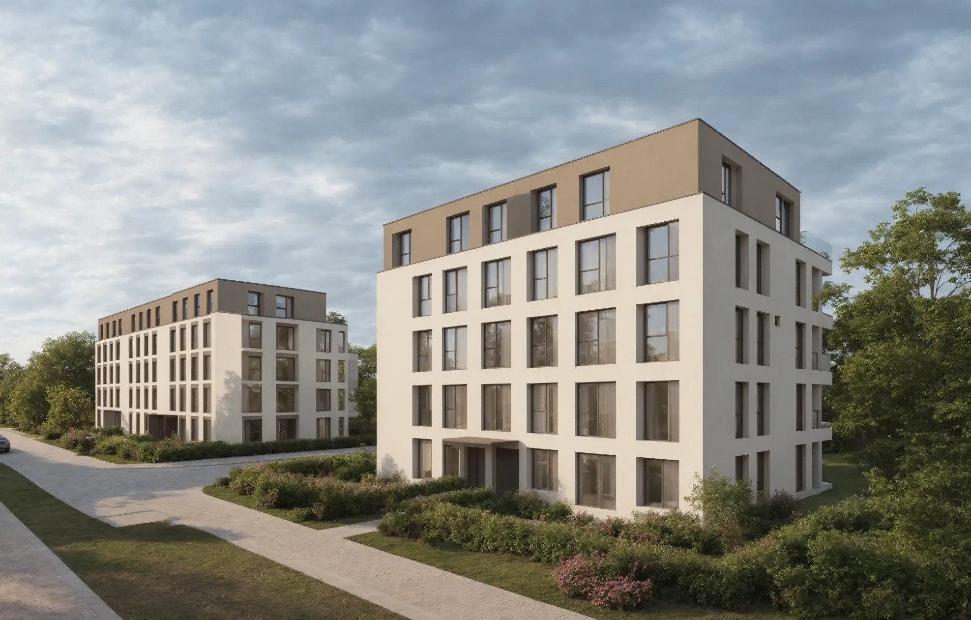Wizualizacja dwóch nowoczesnych budynków mieszkalnych z białymi elewacjami i brązowymi dachami, otoczonych zielenią, prezentowana w pochmurny dzień.