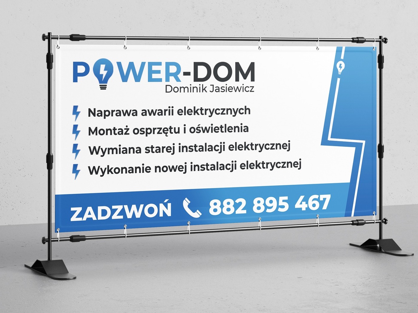 Baner reklamowy firmy Power-Dom z ofertą usług elektrycznych: naprawa awarii, montaż oświetlenia, wymiana i wykonanie instalacji. Numer telefonu 882 895 467.