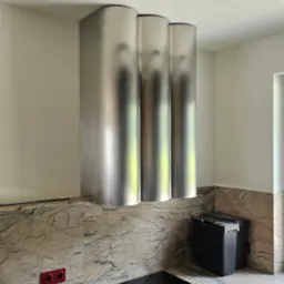 Wykonanie zabudowy pochłaniacza kuchennego. Stal nierdzewna walcowana i szlifowana.