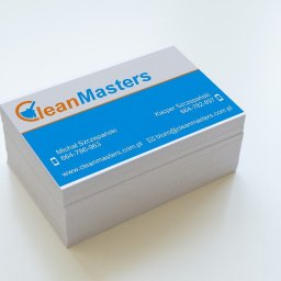 Artiworks Wiesław Małolepszy - Stos wizytówek firmy CleanMasters z niebieskim tłem i pomarańczowym logo. Widoczne dane kontaktowe: imiona, numery telefonów i adres strony internetowej.
