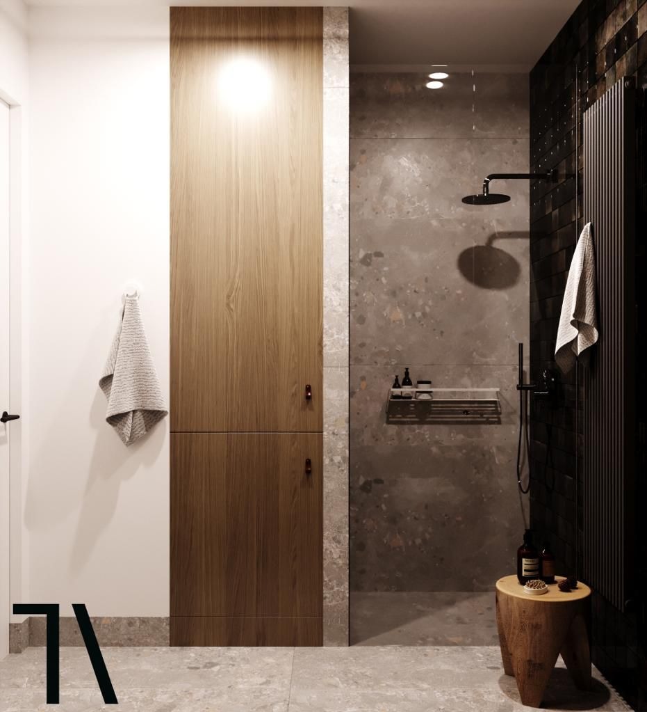 Nowoczesna łazienka z kabiną prysznicową typu walk-in, drewnianą szafką i stołkiem. Minimalistyczny design, szare płytki, czarna armatura i oświetlenie punktowe.
