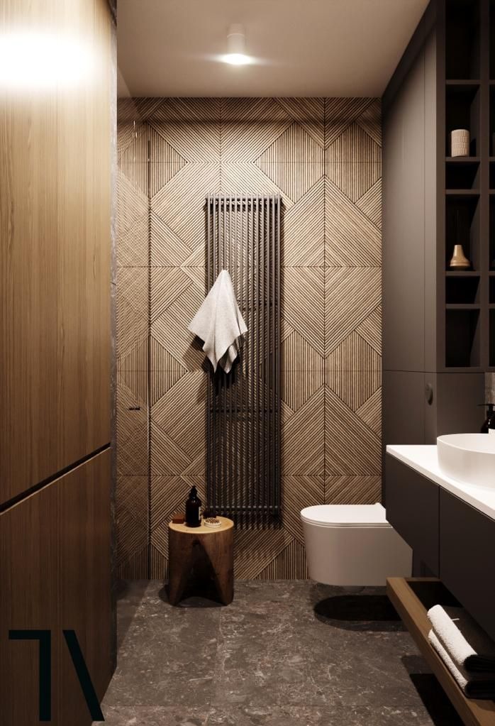 Nowoczesna łazienka z drewnianą okładziną ścienną w geometryczne wzory, grzejnikiem drabinkowym i minimalistyczną umywalką nablatową.