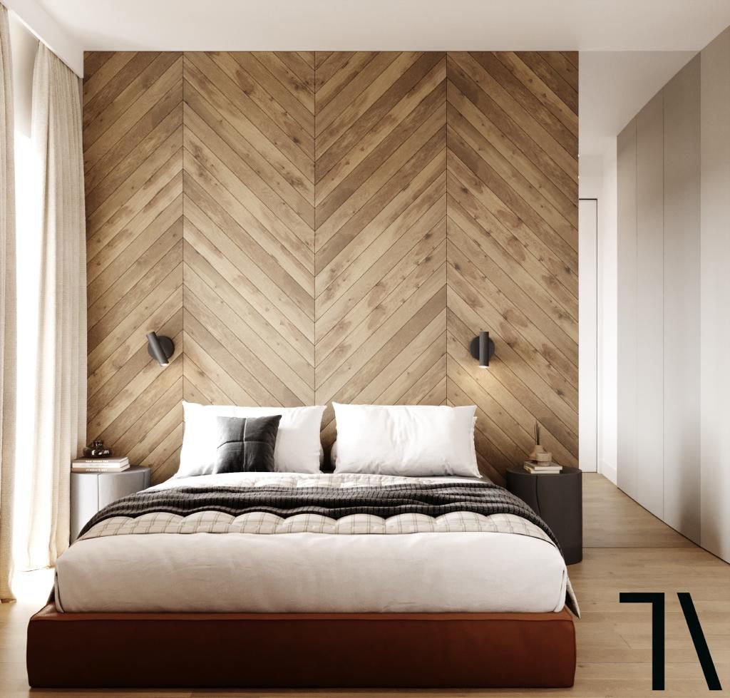 Nowoczesna sypialnia z drewnianą ścianą ułożoną w jodełkę, minimalistyczne lampki nocne i proste szafki. Jasne wnętrze z akcentami drewna i naturalnych materiałów.