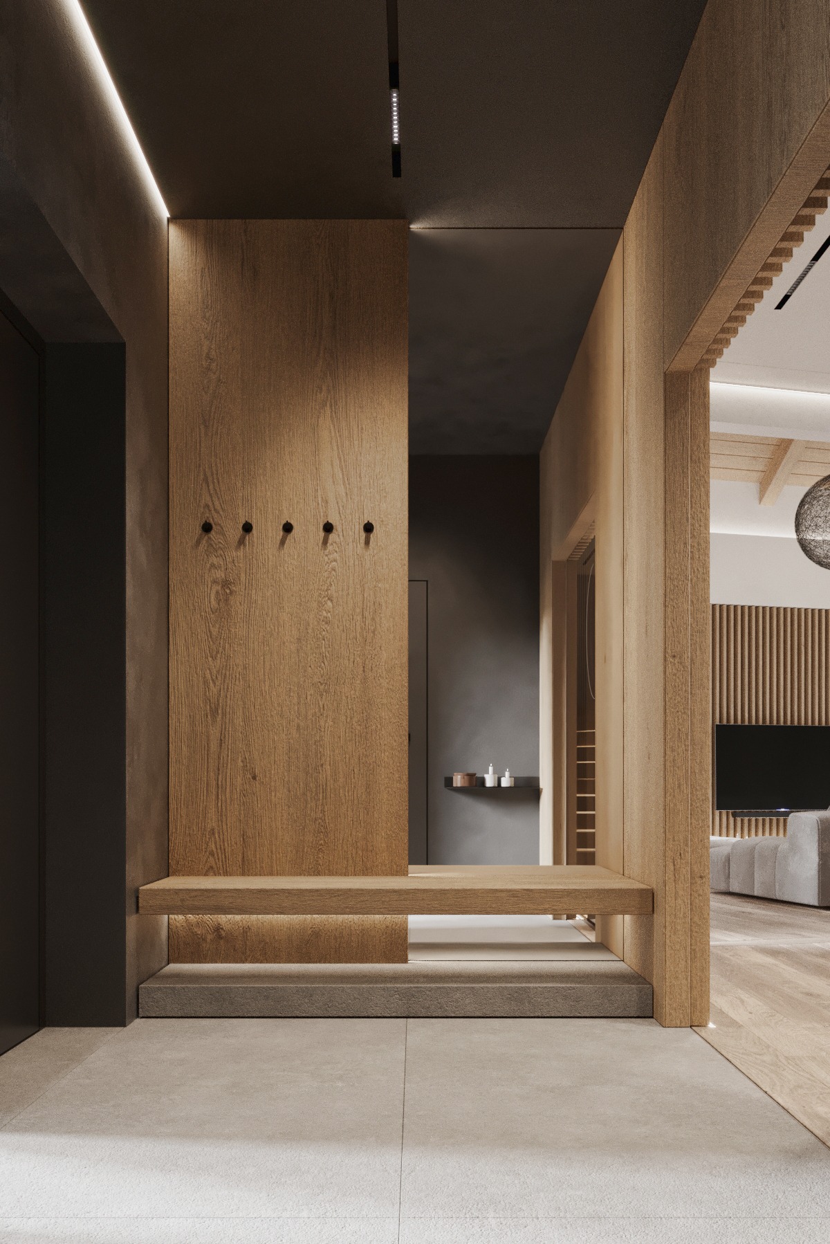 Nowoczesny przedpokój z drewnianą zabudową: wieszak z siedziskiem i oświetleniem LED. Minimalistyczny design, ciepłe odcienie drewna i szarości. Widok na salon.