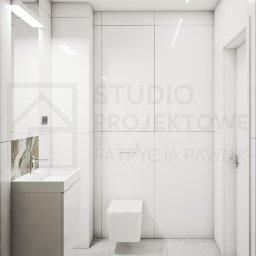 Studio Projektowe Patrycja Pawlus - Minimalistyczna łazienka w bieli z umywalką na szafce i toaletą podwieszaną. Akcent marmuru przy umywalce. Oświetlenie liniowe LED na suficie.