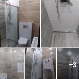 DrigoKomplex B.R.T - Nowoczesna łazienka z kabiną prysznicową typu walk-in, podwieszaną toaletą i płytkami imitującymi drewno. Widoczny odpływ liniowy i minimalistyczna armatura.