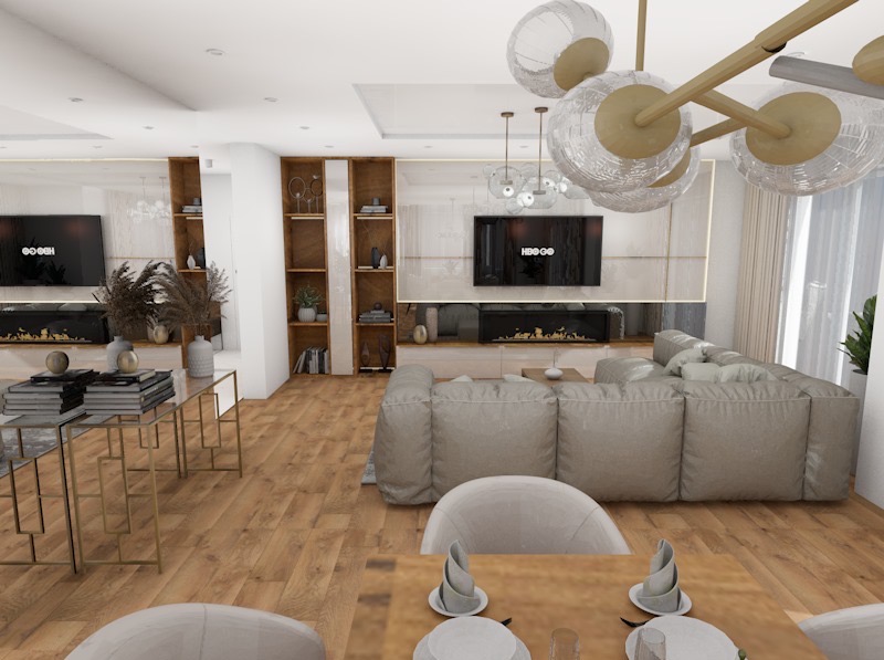 Jasne, przestronne wnętrze salonu z jadalnią. Widoczny duży narożnik, stół z nakryciem i nowoczesne oświetlenie. Na ścianie telewizor nad kominkiem.