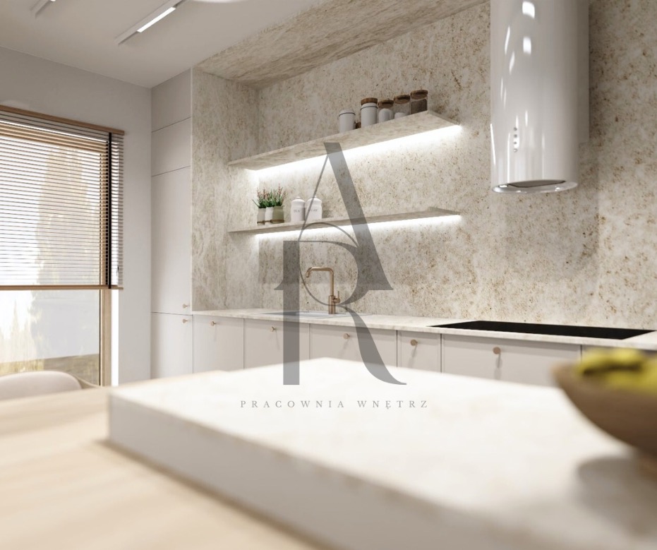 Jasna kuchnia z kamienną ścianą, oświetlonymi półkami i białym okapem. Minimalistyczny design, ciepłe światło, widok na blat kuchenny z bliska.