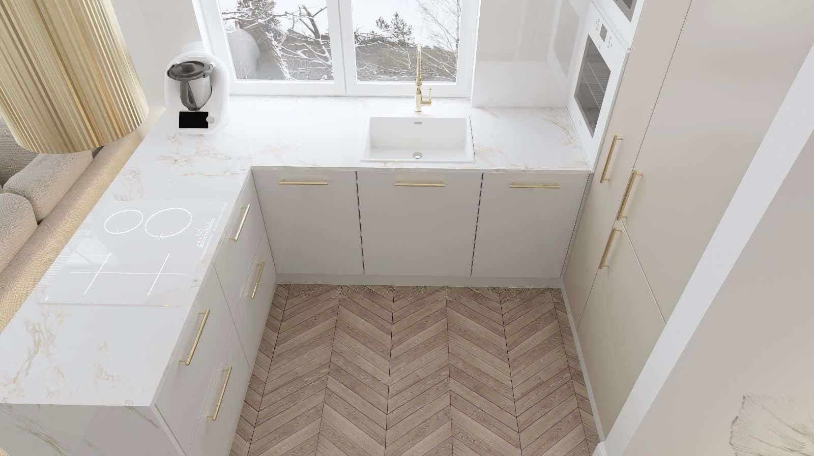 Nowoczesna kuchnia na wymiar z białymi frontami, złotymi uchwytami i blatem imitującym marmur. Widok z góry na płytę indukcyjną i zlew. Parkiet w jodełkę na podłodze.