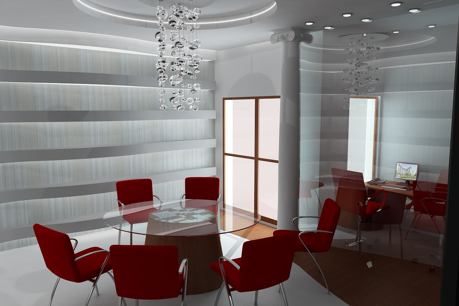 Nowoczesna sala konferencyjna z okrągłym stołem, czerwonymi krzesłami i dekoracyjnym żyrandolem. Widoczne biurko z komputerem w tle.