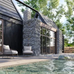 Nowoczesny dom z kamiennymi elementami, drewnianą elewacją i dużymi oknami, otoczony zielenią, widziany z perspektywy basenu. Dwa krzesła na tarasie.
