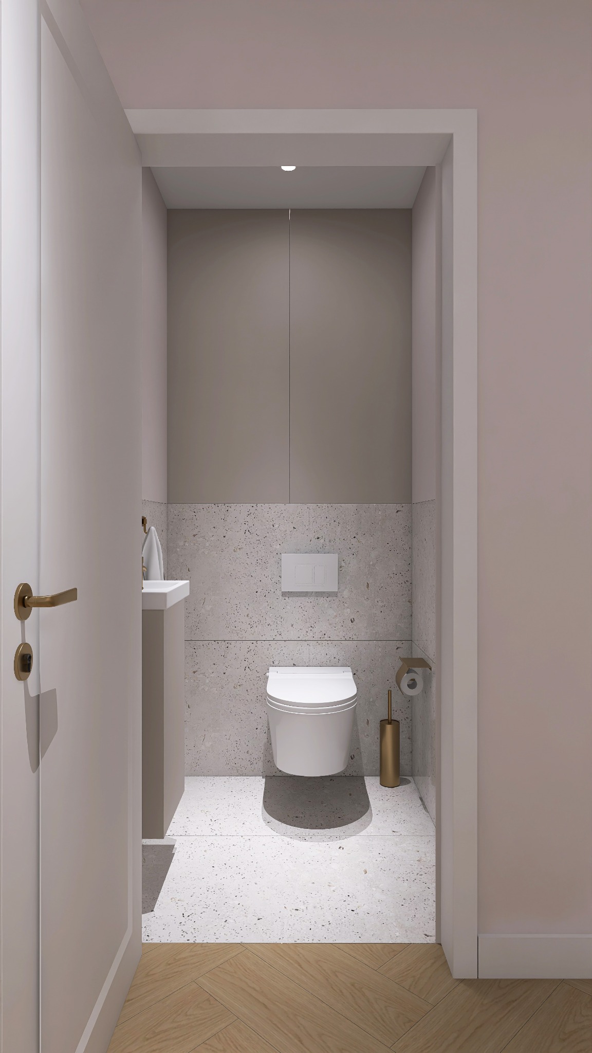 Nowoczesna toaleta w odcieniach beżu i bieli, z umywalką, wiszącą muszlą klozetową i złotymi akcentami. Podłoga z lastryko przechodzi w parkiet.