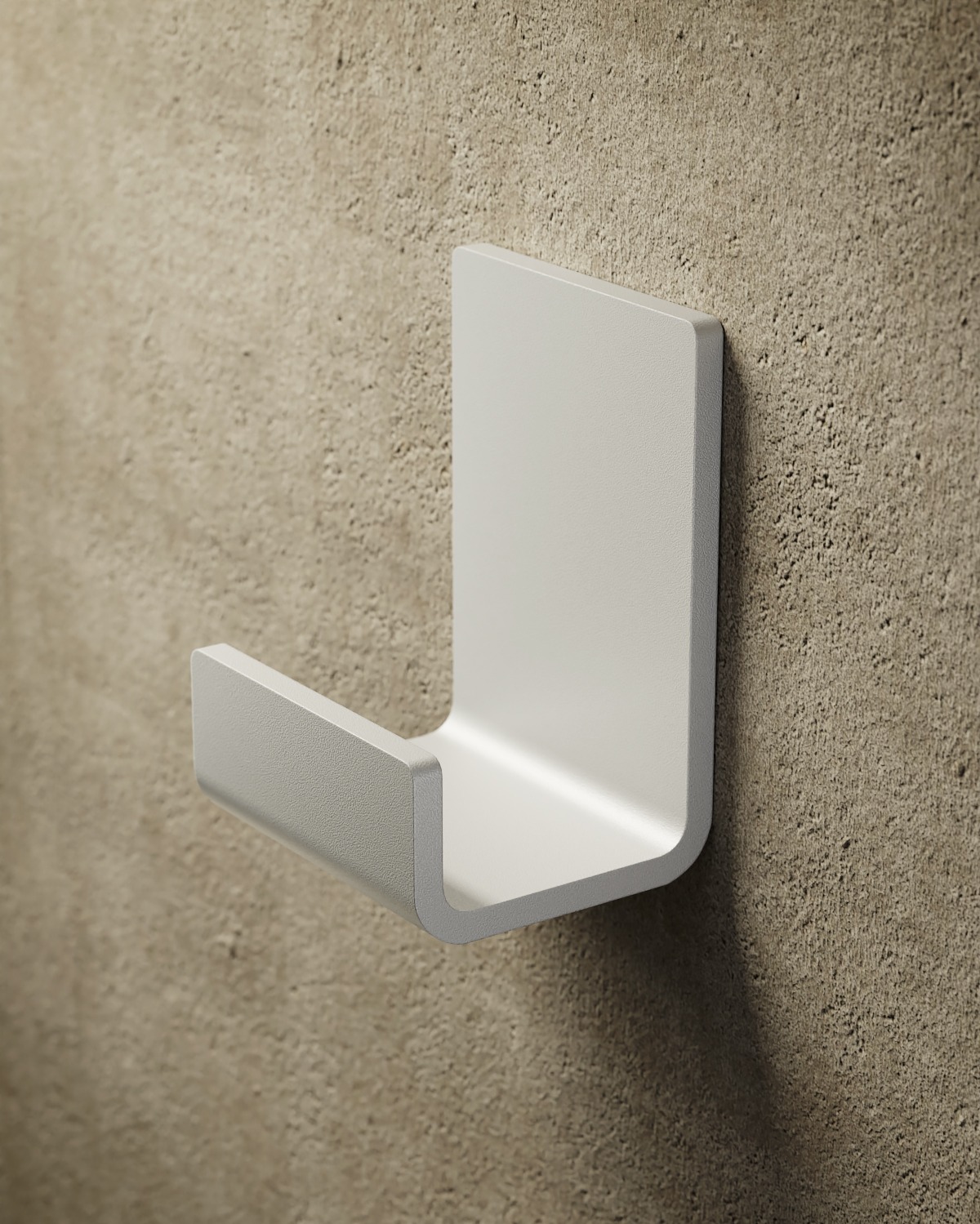 Minimalistyczny, biały wieszak ścienny z zaokrąglonymi krawędziami na surowej, beżowej ścianie. Prosty design, neutralna kolorystyka, nowoczesny akcent w aranżacji wnętrz.