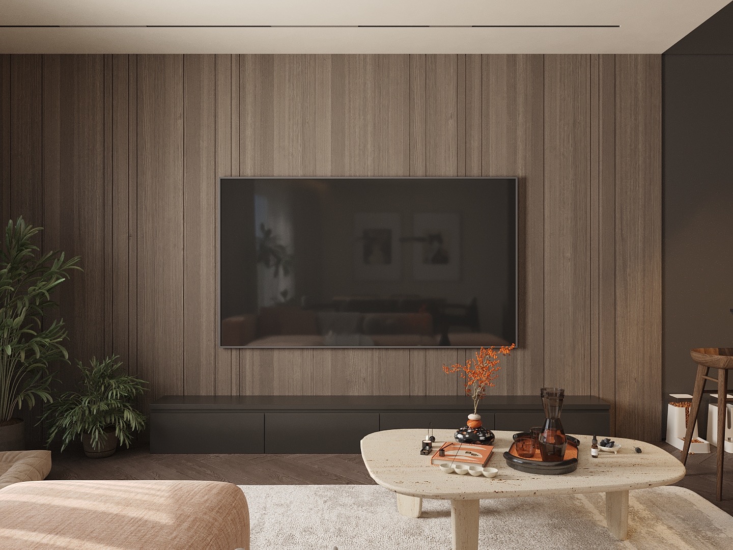 Minimalistyczny salon z drewnianą ścianą, telewizorem, niską szafką RTV i owalnym stolikiem kawowym z dekoracjami. Stonowana kolorystyka, rośliny doniczkowe.