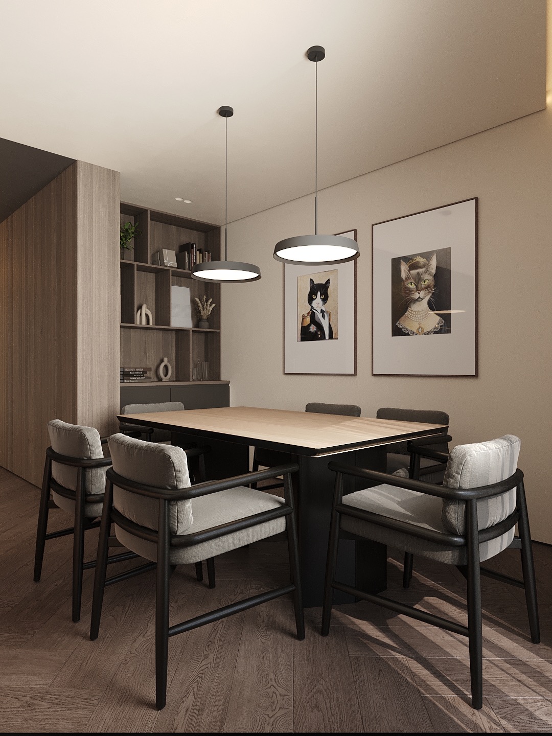 Nowoczesna jadalnia: stół z jasnym blatem, czarne krzesła z szarymi poduszkami, okrągłe lampy sufitowe i grafiki z kotami w ramkach. Minimalistyczny design.