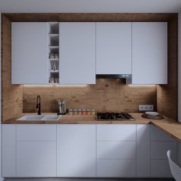 Atelier Project Viktar Danilevich - Nowoczesna kuchnia z białymi szafkami i drewnianym blatem, oświetlona ciepłym światłem, z czarną armaturą i przyprawami w szklanych słoiczkach.