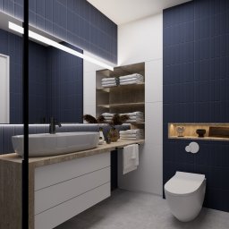 Atelier Project Viktar Danilevich - Nowoczesna łazienka z umywalką nablatową, granatowymi płytkami i drewnianymi akcentami. Minimalistyczny design z oświetleniem LED i dekoracyjnymi elementami.