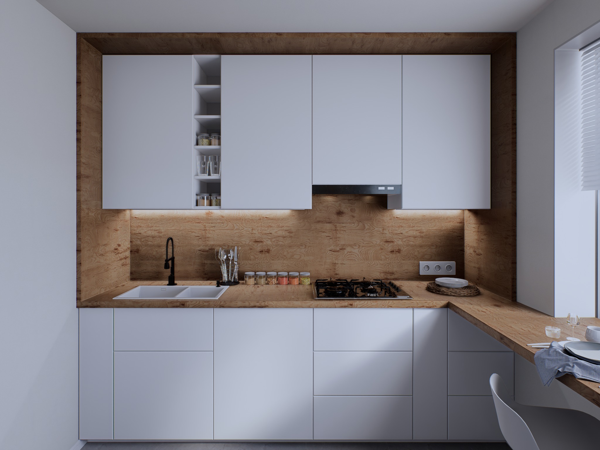 Nowoczesna kuchnia z białymi szafkami i drewnianym blatem, oświetlona ciepłym światłem, z czarną armaturą i przyprawami w szklanych słoiczkach.