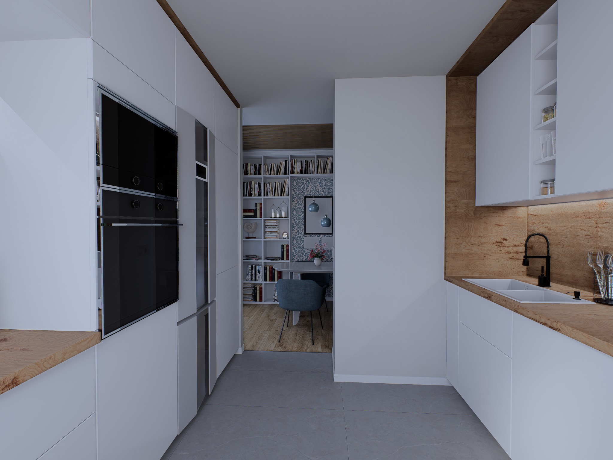 Nowoczesna kuchnia z białymi szafkami i drewnianym blatem. W tle widoczny stół i krzesła oraz regał z książkami. Minimalistyczny design z akcentami drewna.