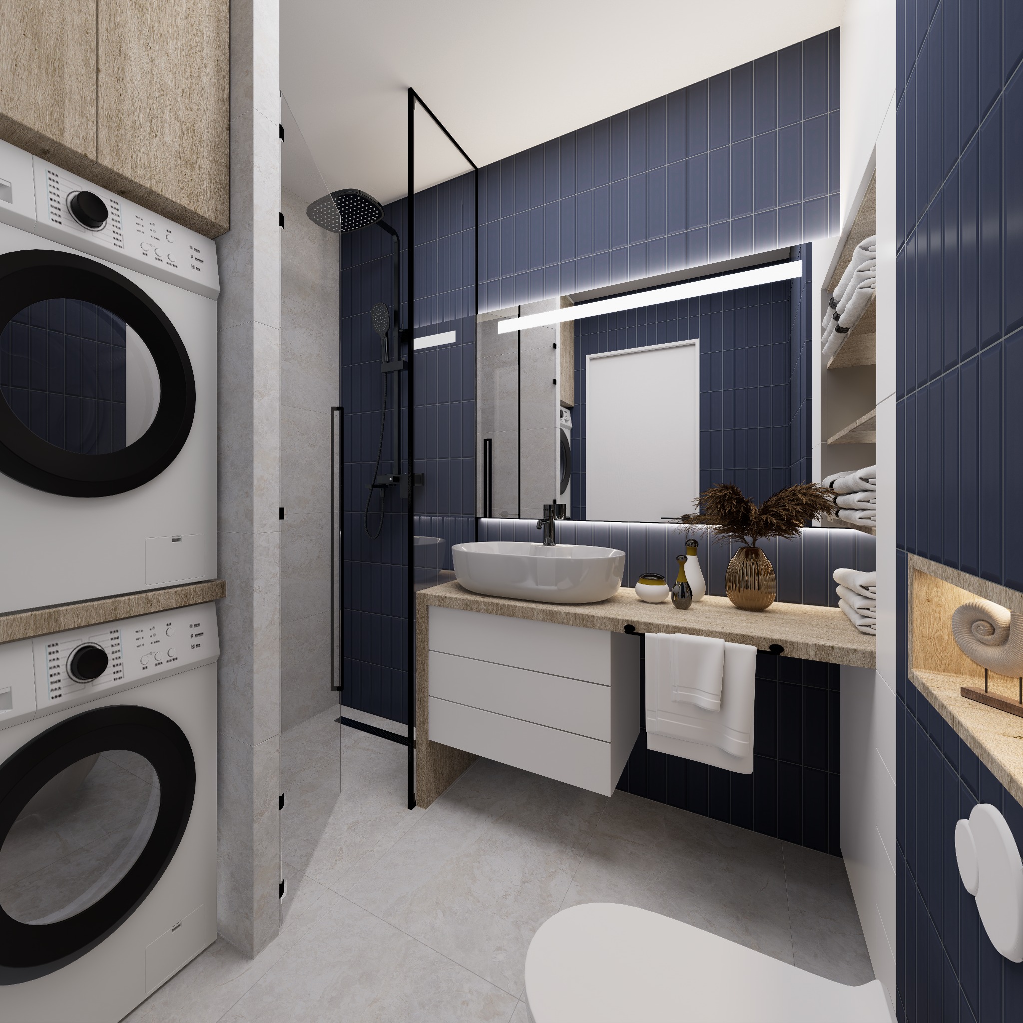 Nowoczesna łazienka z pralką w zabudowie, kabiną prysznicową typu walk-in i umywalką nablatową na tle granatowych płytek. Minimalistyczny design, jasne oświetlenie.