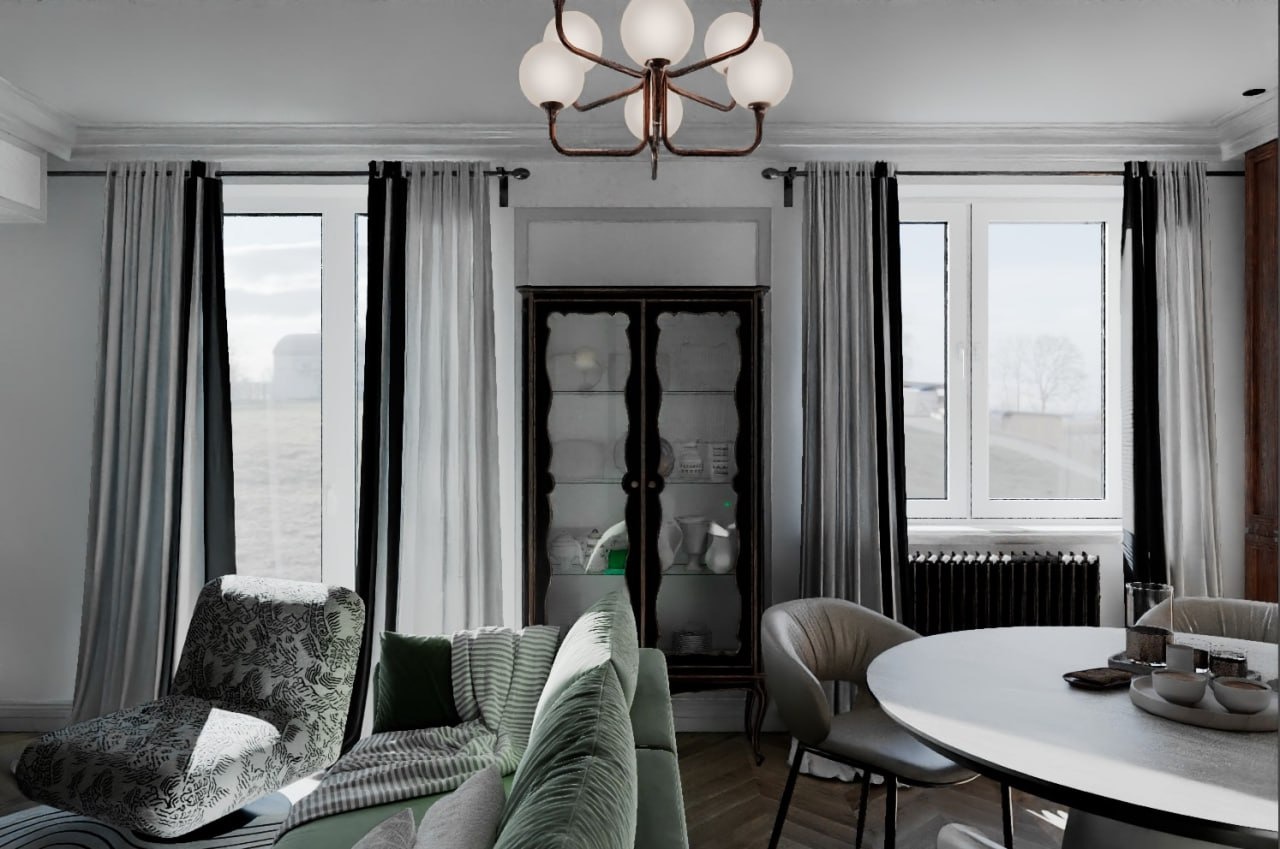 Elegancki salon z zieloną sofą, wzorzystym fotelem i klasyczną witryną. Okna z czarno-białymi zasłonami wpuszczają naturalne światło. Lampa sufitowa dodaje uroku.