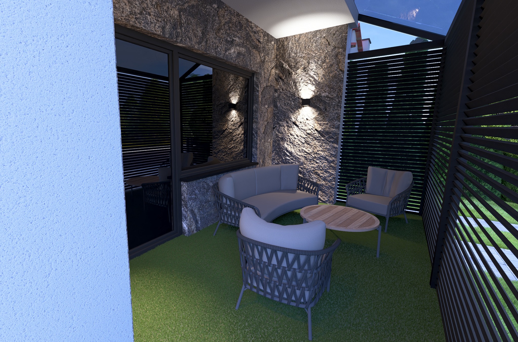 Nowoczesny balkon z kamienną ścianą, szarymi meblami wypoczynkowymi i sztuczną trawą. Stonowana kolorystyka, oświetlenie punktowe podkreśla fakturę kamienia.