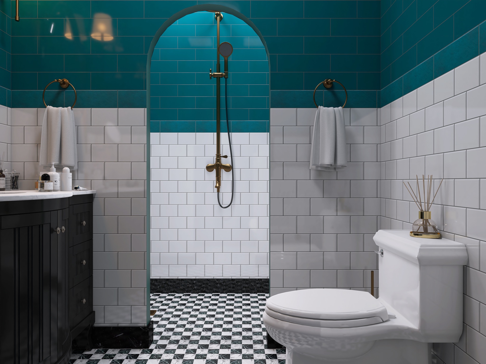 Wnętrze łazienki z biało-turkusowymi płytkami, czarną szafką pod umywalką i mozaikową podłogą. Złota armatura i biała toaleta. Widok na kabinę prysznicową.