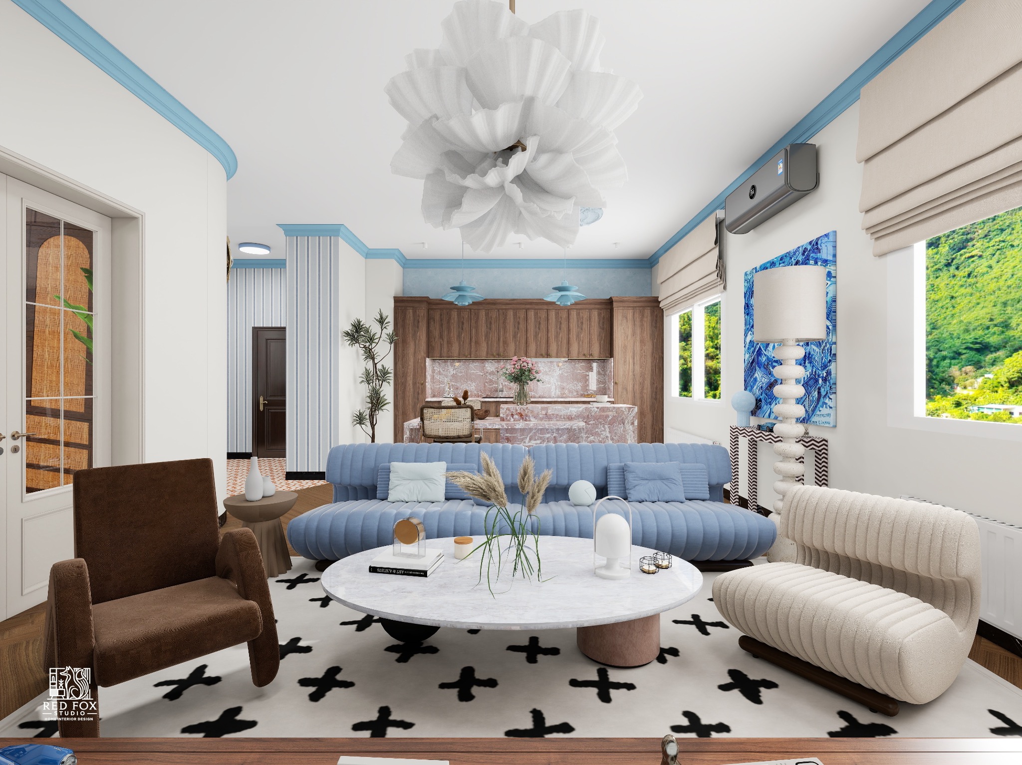 Wnętrze salonu z błękitnym akcentem: sofa, fotel, okrągły stolik na wzorzystym dywanie. W tle aneks kuchenny i widok na góry przez okno.
