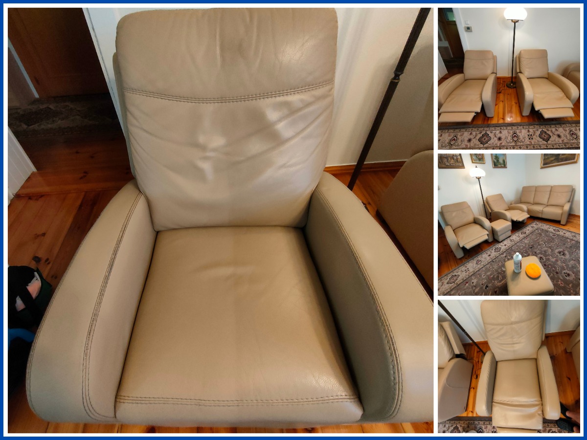 Beżowy skórzany fotel relaksacyjny z widocznymi przeszyciami, na drewnianej podłodze. W tle inne meble wypoczynkowe w tym samym kolorze.